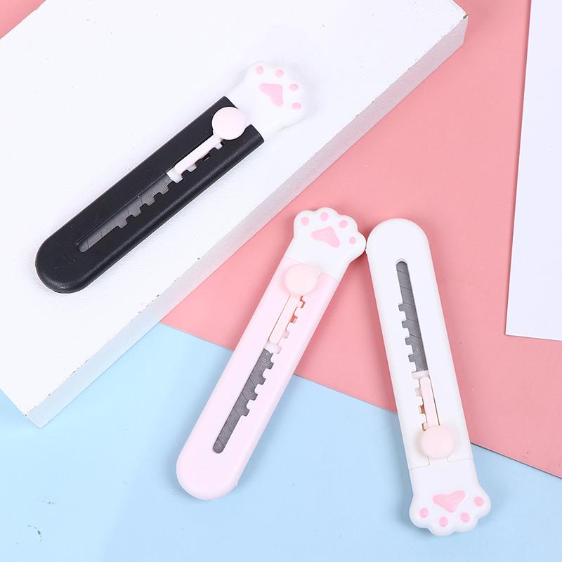 Канцелярский выдвижной нож в пластиковом корпусе с кошачьей лапкой ...