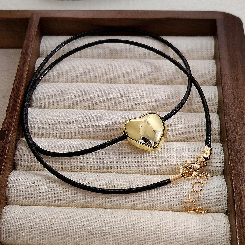 Korean-Style Heart Necklace: Versatile Black Rope with Niche Peach Heart Pendant, Adjustable Sweater Chain for Women.
