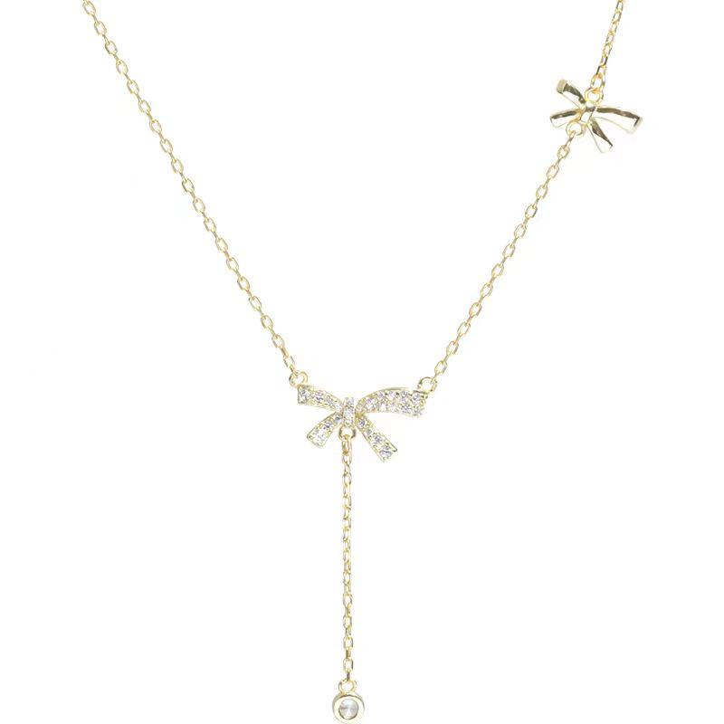 

Элегантное ожерелье с подвеской в виде банта с кисточкой - легкий роскошный дизайн для женщин золотой