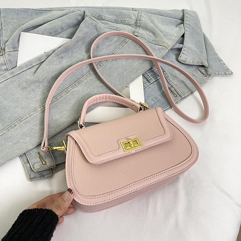 Spring niche design fashionable contrasting color saddle bag portable shoulder crossbody trendy women's bag