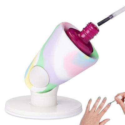 Nagu lakas pudeles turētāja rokturis un uzgaļu pretizliešanas statīvs nagu krāsošanai.