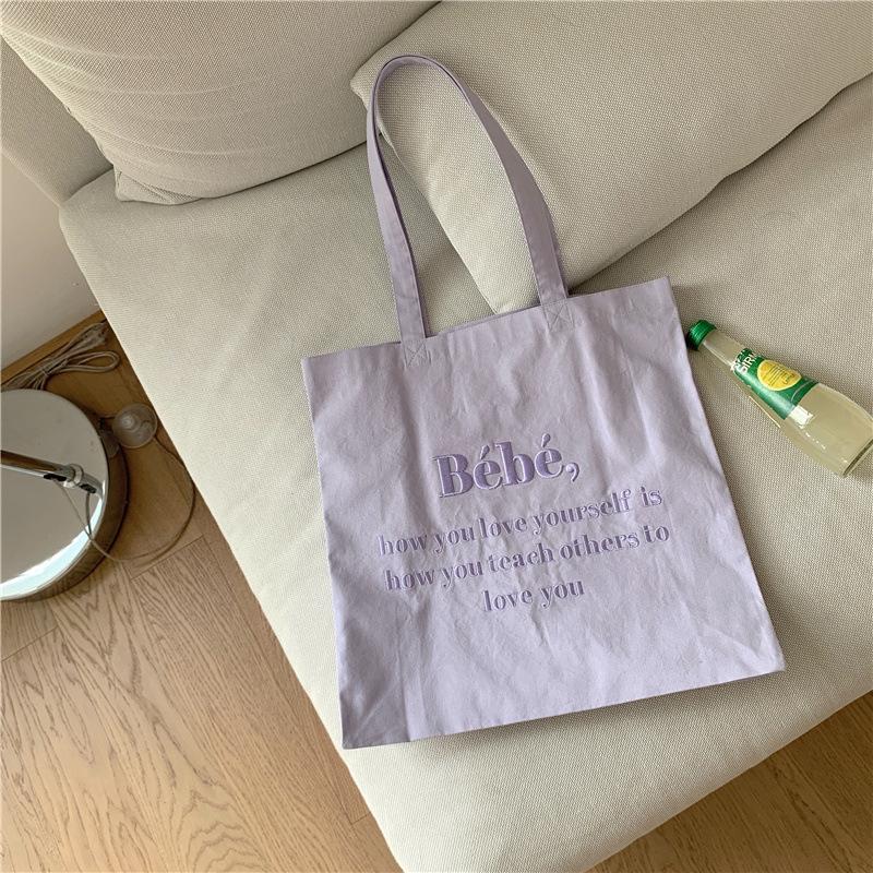 

[Spot] Korean Bebe letter embroidered canvas bag ins Korean macaron student shoulder bag фиолетовый