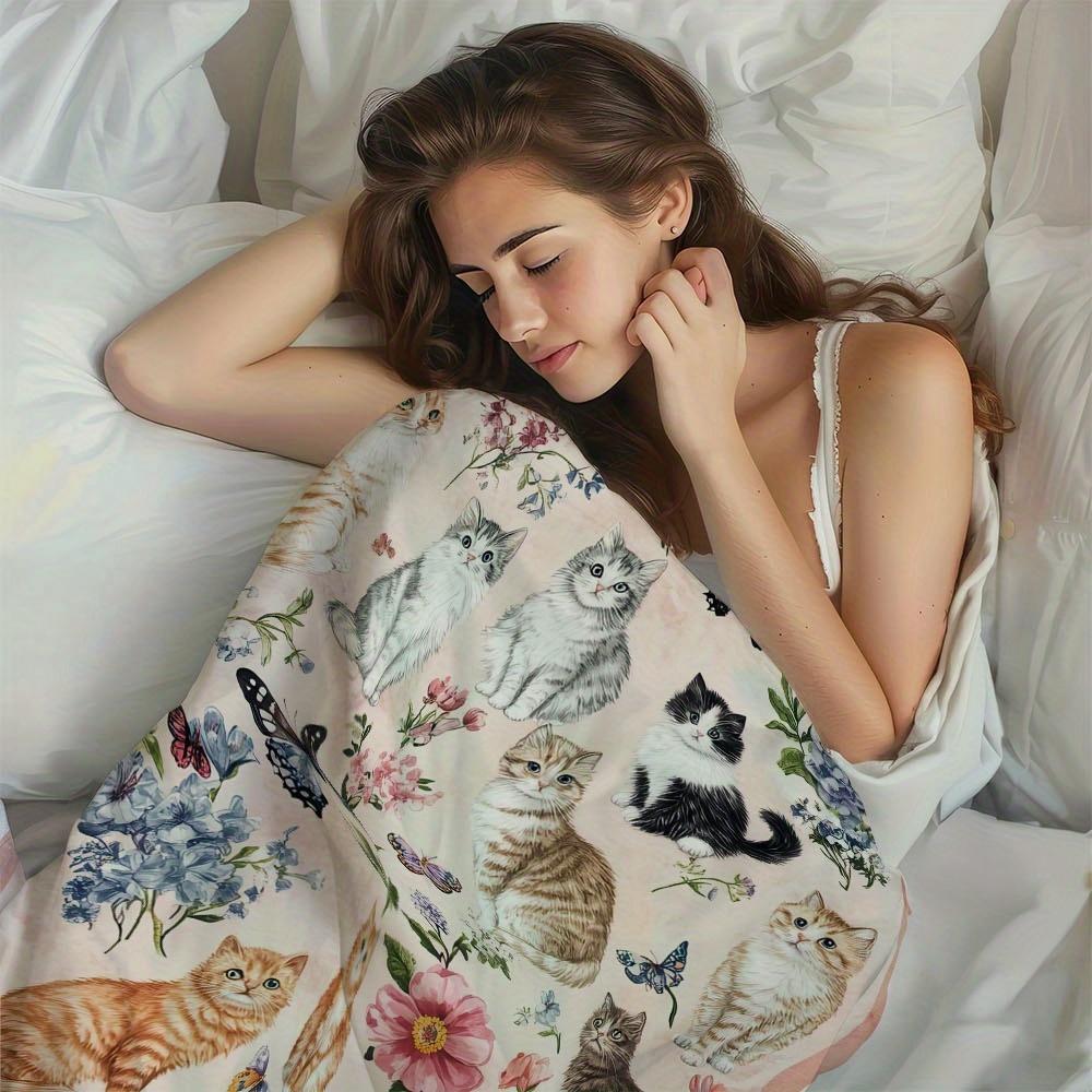 A Single Cozy And Soft Fleece Throw Blanket Featuring Adorable Cats And a Floral Pattern, Ideal for Use On a Couch, Sofa, Bed, Or In The Liv