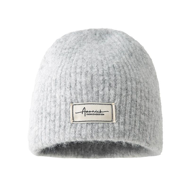 Simple cloth label wool wool hat women's autumn and winter comfortable cold hat outdoor cycling ear hat fashionable versatile knitted hat