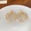 Bohemian round thread hollow multi-layer ear hook European and American cold wind earrings light luxury high-end earrings