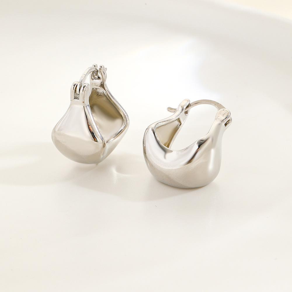 

Минималистичные серьги-капли с медным покрытием - Гладкая U-образная форма, Полый дизайн, Стойкий цвет для женщин