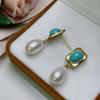High-quality freshwater rice-shaped genuine pearl earrings, exuding elegance and a sophisticated, understated style, with turquoise accents, a niche