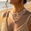 Bohemian Handgefertigter Seestern Sonne Anhänger Halskette für Damen Sommer Muschel Imitation Perle Reiskorn Perlen Choker Strandurlaub Schmuck