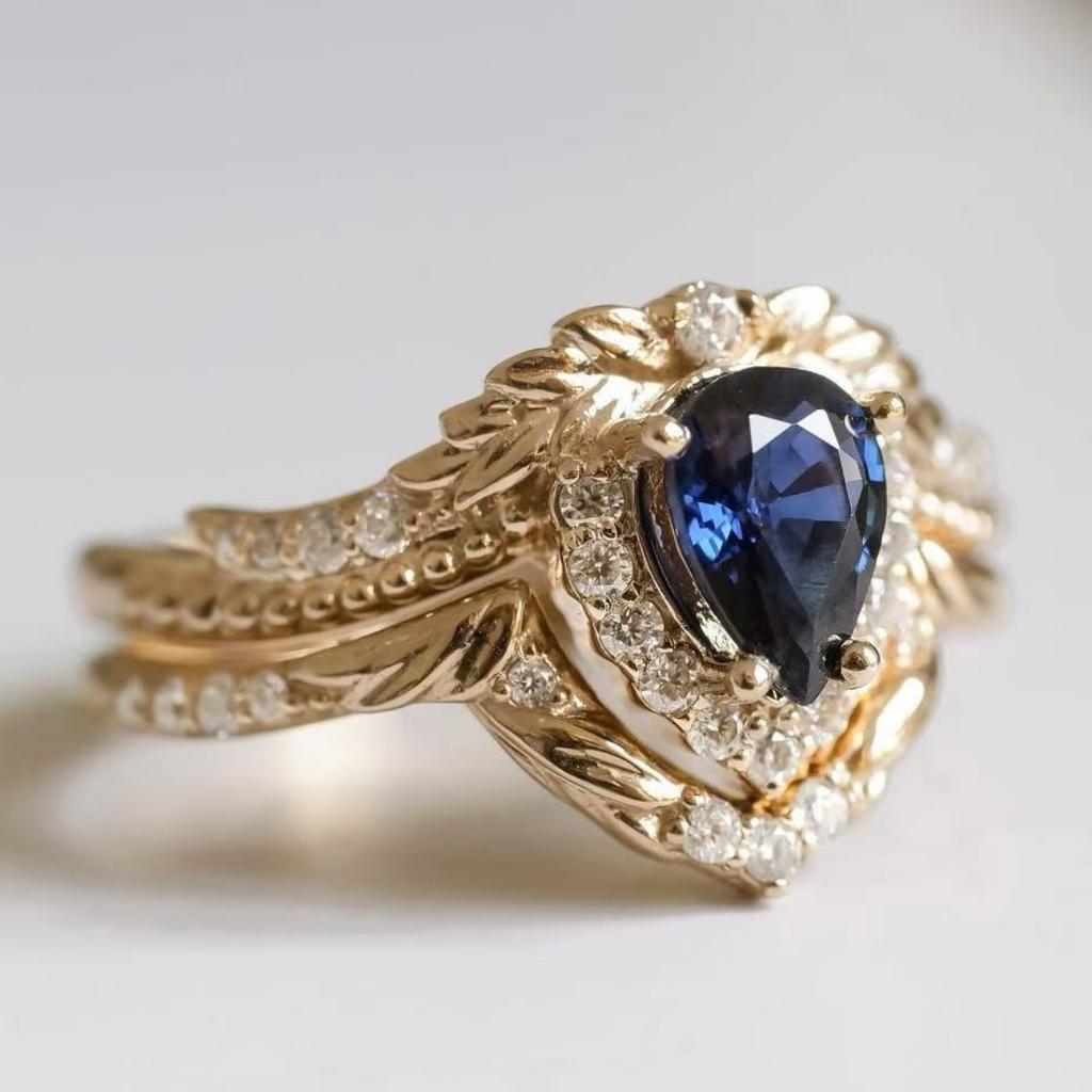 Luxury European and American Flower Wedding Ring Women's Fashion Crown Jewelry Inlaid with Blue Water Drop Zircon Set Ring