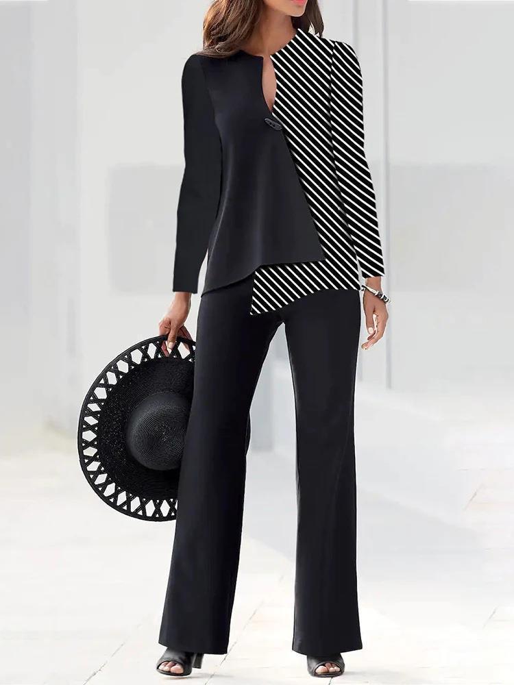 

Жіночий топ з контрастними панелями чорного та білого кольорів та штани широкого крою 3XL