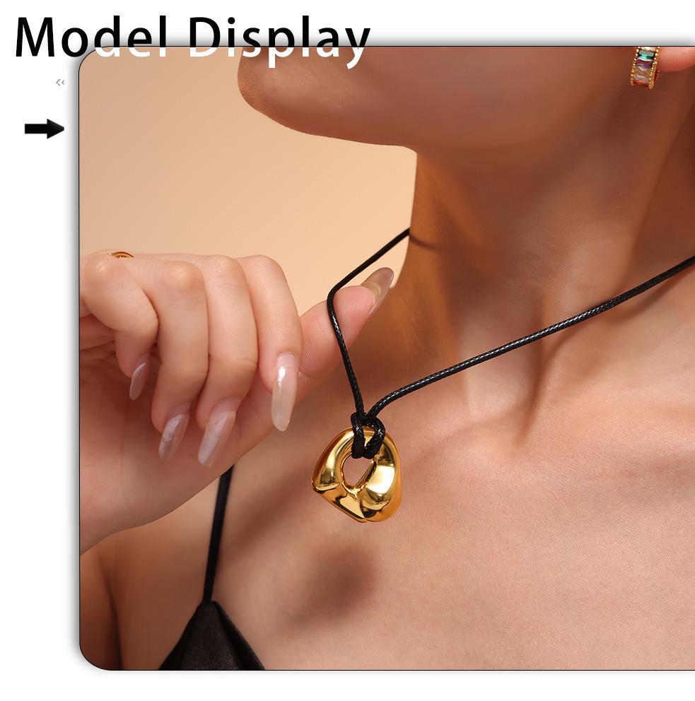 Qiong Yao Stainless Steel Curved Pendant Necklace with Black Leather Cord, Adjustable Length, Simple High-End Design for Women.