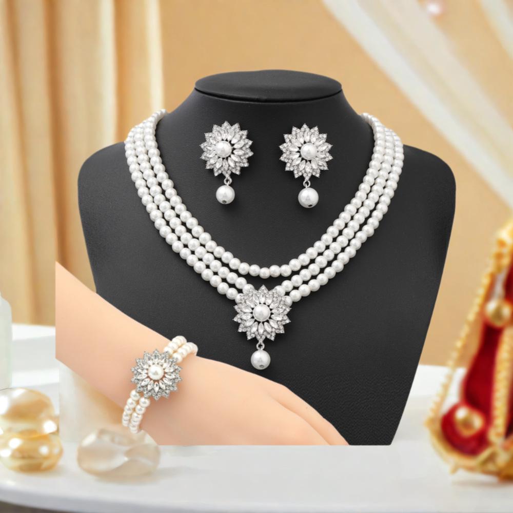 Elegant Imitation Pearl Jewelry Set: Necklace, Earrings & Bracelet for Prom, Party, Vacation, or Bridal Gown.