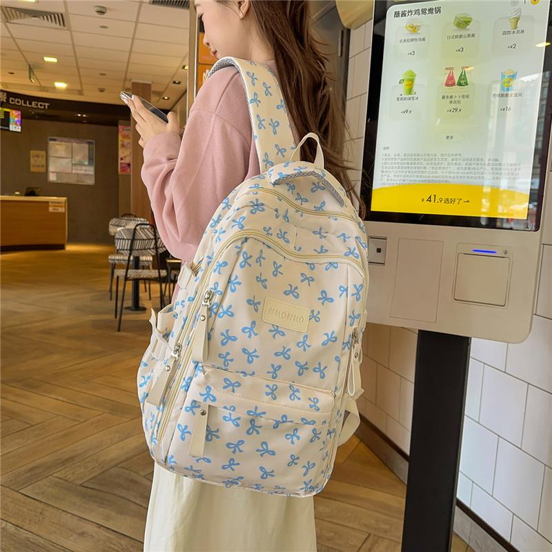 Cute Bow Print Backpack for Women Lightweight Casual Daypack Travel School Bag with Multi Pockets