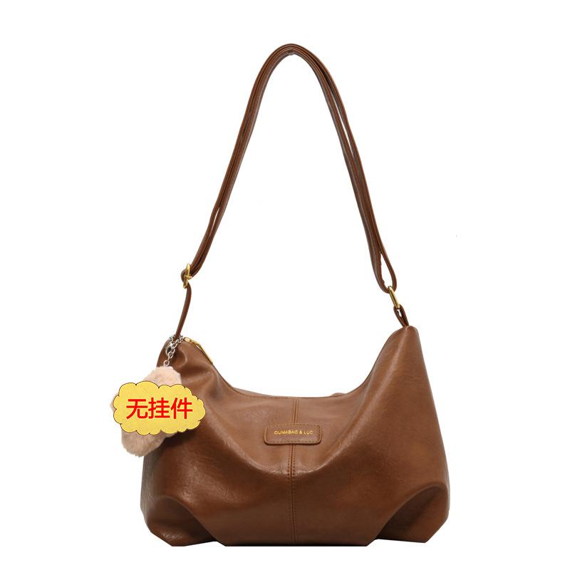 

Large capacity bag women s autumn 2025 new fashion niche design shoulder messenger bag Internet celebrity explosion dumpling bag коричневый