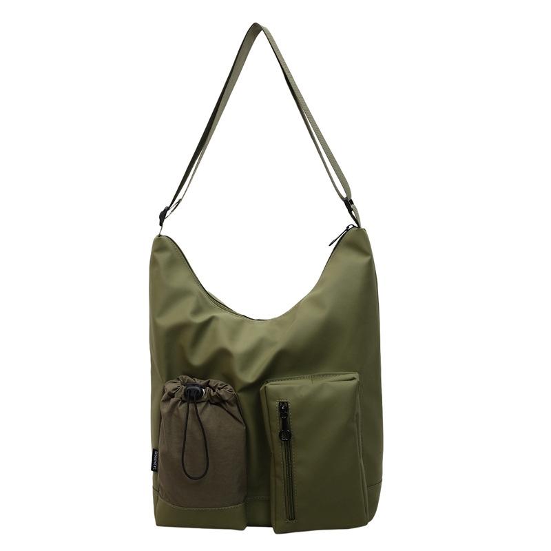 

Simple casual shoulder bag, messenger bag, solid color women s bag, fashionable niche, large-capacity commuter bucket bag. зелёный