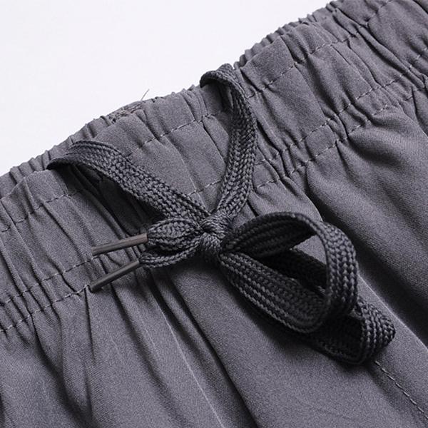 Nové letní pánské kalhoty tenkého dílu, volné prodyšné pánské kalhoty s vysokým pasem