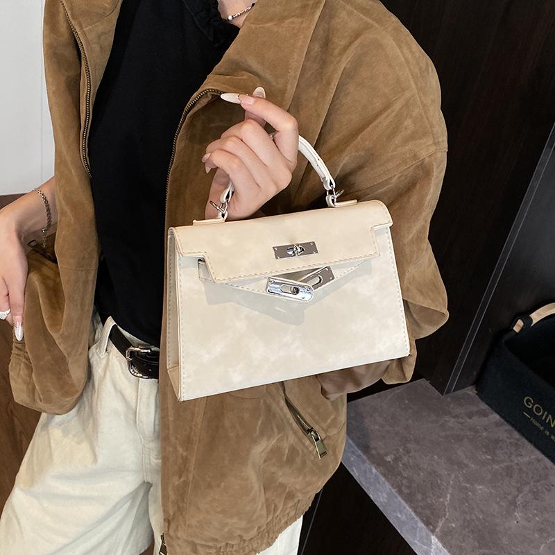 

Ретро матовая женская сумочка 2025: Новая модная сумка Kelly через плечо и кроссбоди в стиле легкой роскоши грязно-белый
