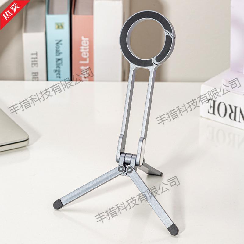 Magnetic Climbing Buckle Phone Holder: Portable Triangle Bracket for Outdoor Photography and Live Streaming.