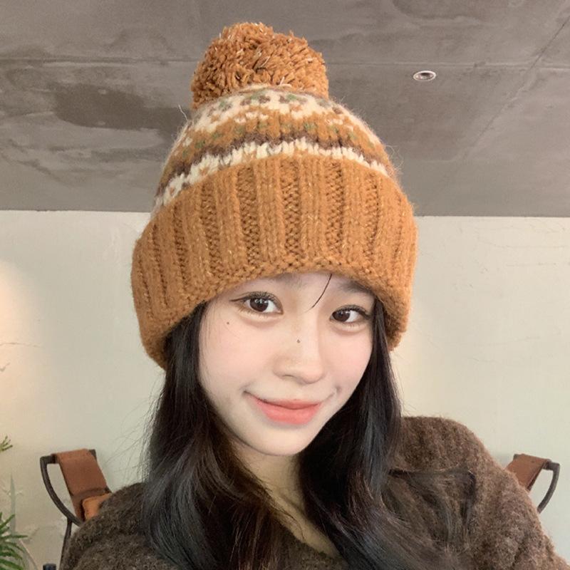 Winter new jacquard contrasting wool hat women's thickened warm windproof hat pullover hat cute hairball knitted hat