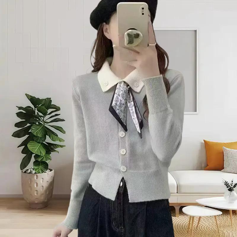 

New lapel long-sleeved knitted sweater women s early autumn spring and autumn new contrasting color silk scarf lace-up cardigan short top average size серый