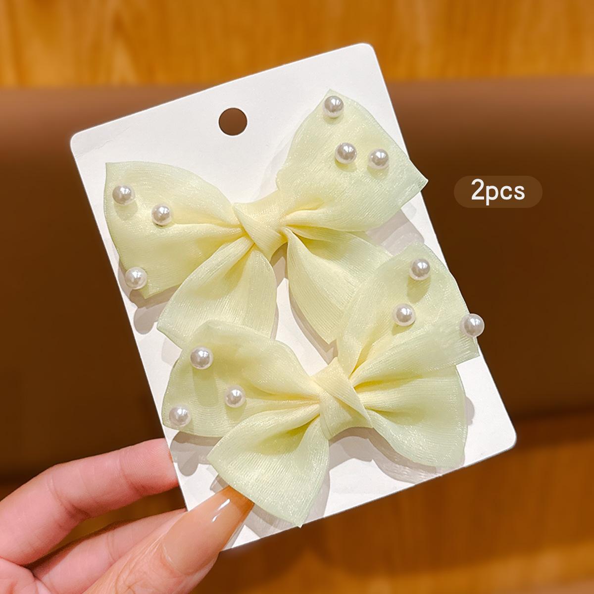 

2 cute yellow bow hair clips and hair accessories for daily use Size fits all