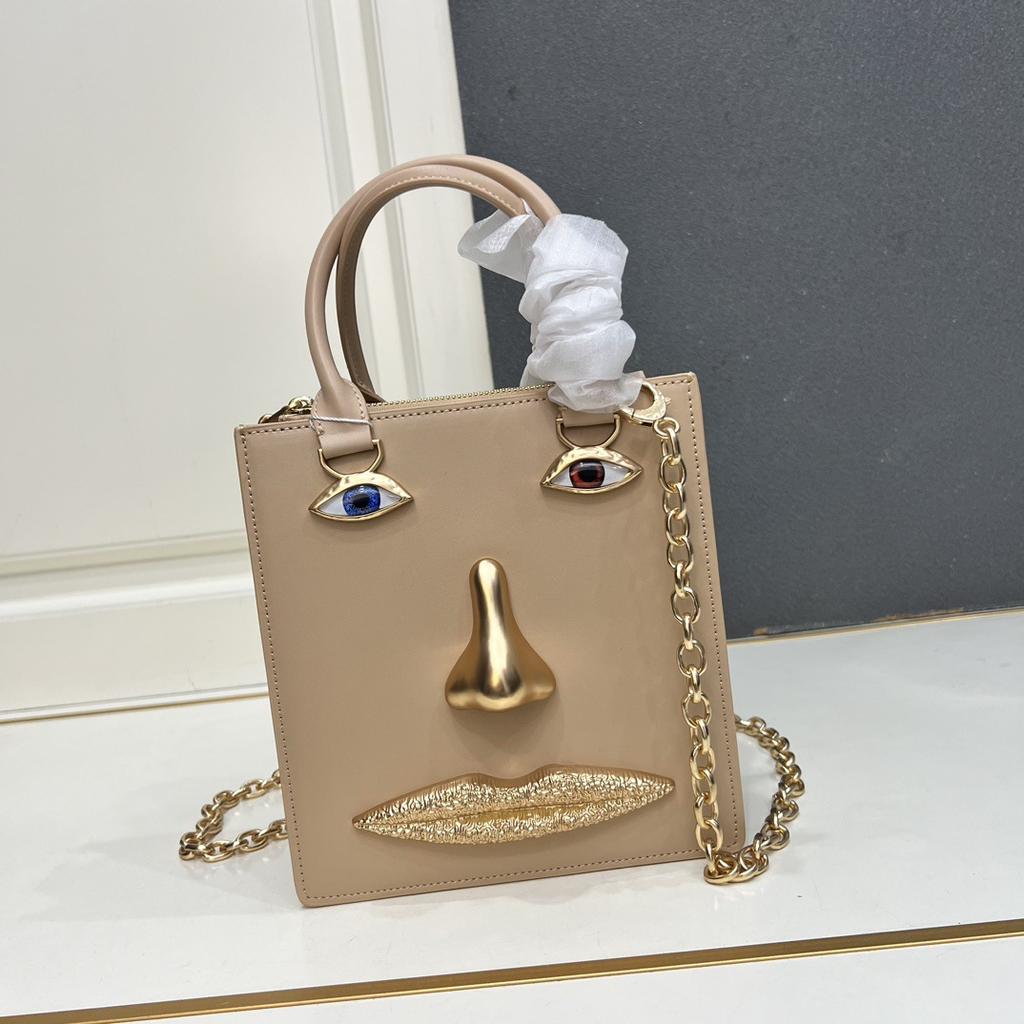 26 trendy new schiap face women's bag plain weave cowhide chain design sense hand-held tote bag