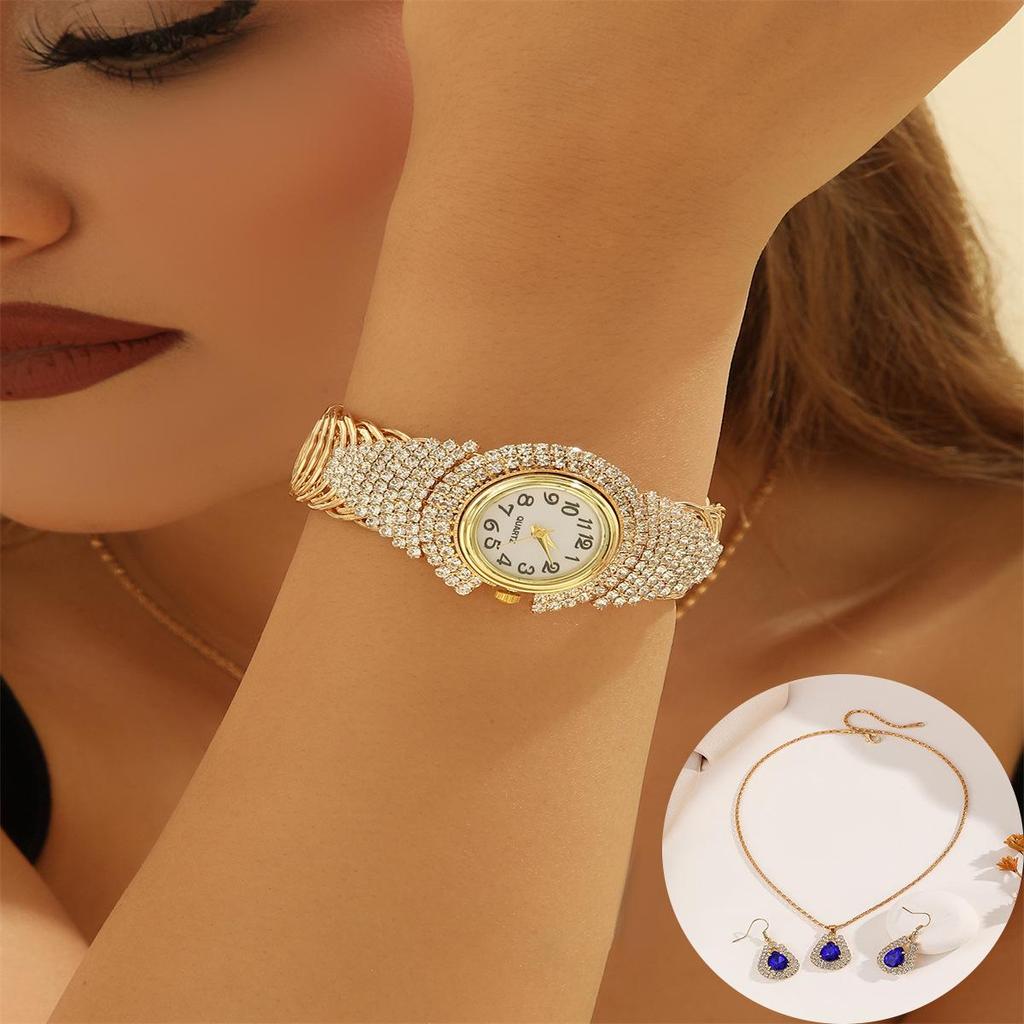 Nové dámské slitinové křemenné náramkové hodinky s náramkem s křídly z plných diamantů