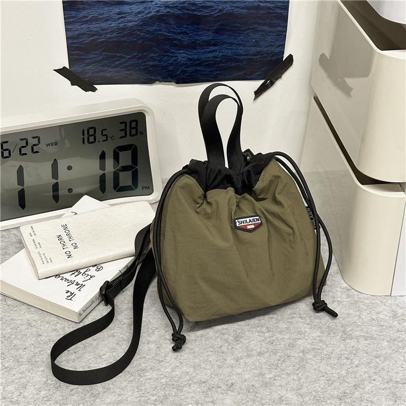 Japanese casual oblique span bag 2025 new Korean version fashionable versatile commuter sports small bag tooling shoulder bucket bag