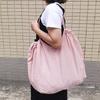 Eco-Friendly Foldable Shopping Tote with Buckle, Drawstring Closure, and Single Shoulder Strap