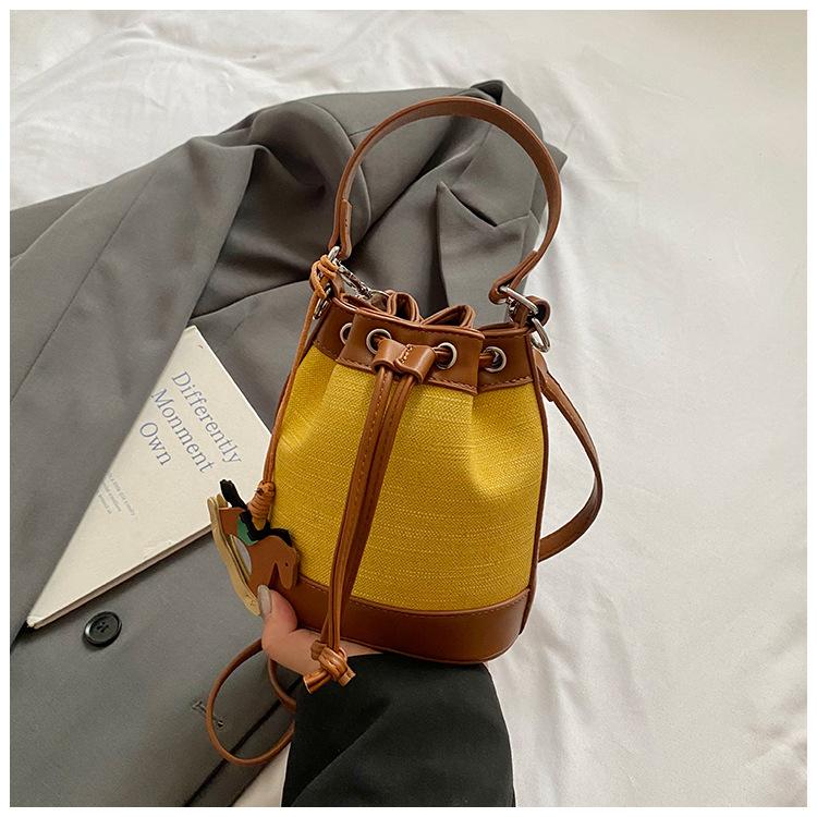 Stylish and simple contrasting color bucket bag women's 2025 new shoulder messenger bag high value casual strap handbag