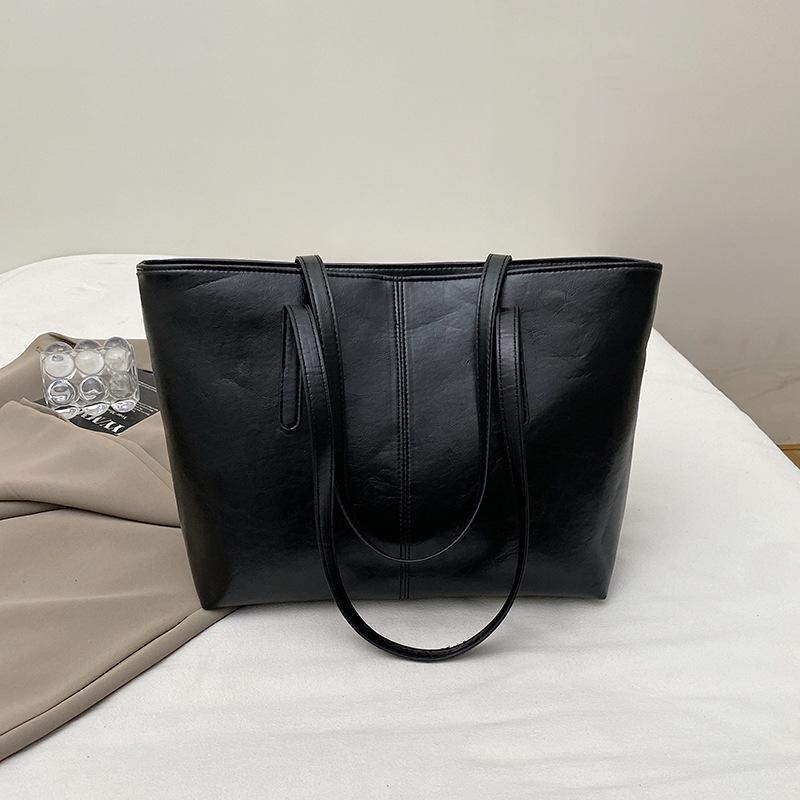 

Tote bag women s new large-capacity portable commuter shoulder autumn and winter fashion simple college student class big bag
