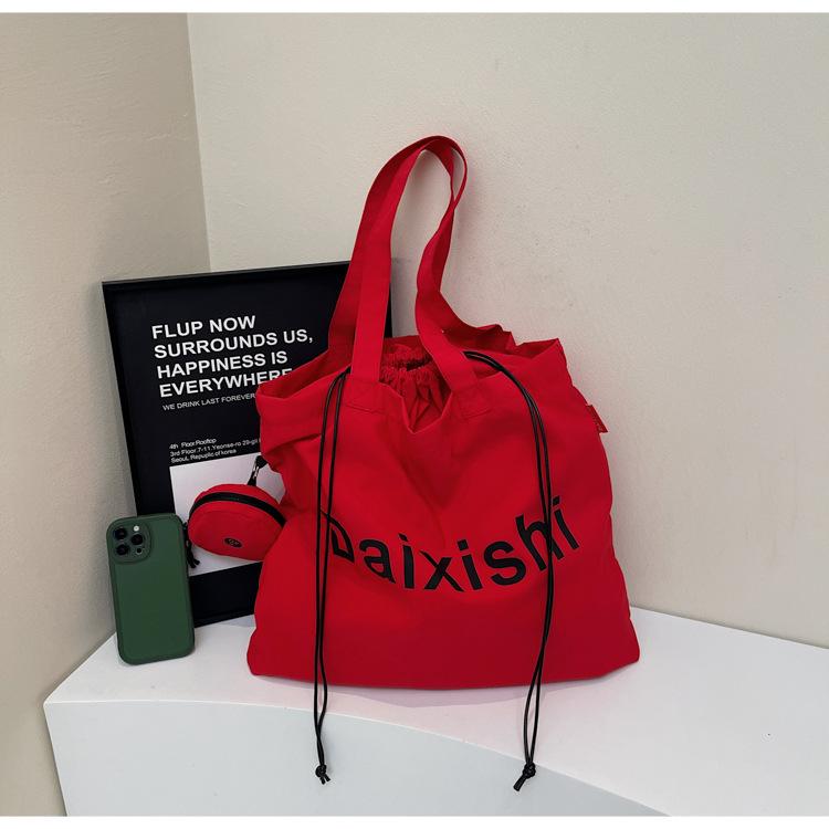 College students commute to class, large-capacity tote bag, women's 2025 new leisure child and mother canvas shoulder handbag