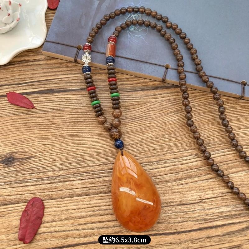 Retro chicken wing wood second generation old beeswax necklace men and women versatile amber pendant long sweater chain pendant