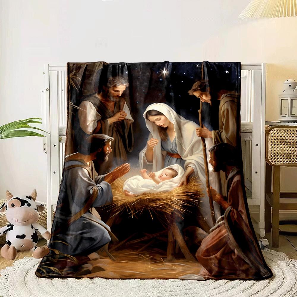 A radiant newborn in a manger surrounded by figures under a glowing sky. for all seasons blanket lunch break throw gift 80cm x 120cm