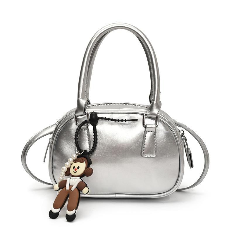 

Korean version of casual niche casual dopamine color portable bowling bag spring and summer popular versatile simple messenger bag women срібний
