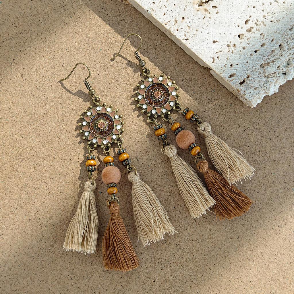 Retro ethnic style woven feathers long fringed earrings, bohemian high-end hollow rice bead earrings