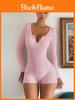 Combinaison moulante longue à manches longues taille haute rose et noire avec fermeture à boutons pour le sport