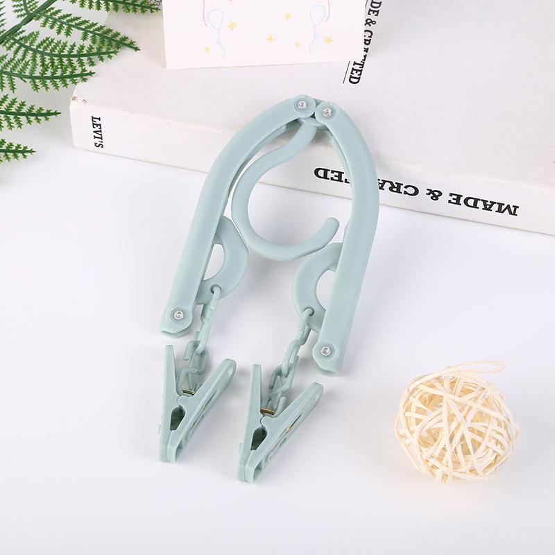 Multifunctional Non-Slip Folding Clothes Hanger & Drying Rack for Travel, Dormitory, or Hotel.