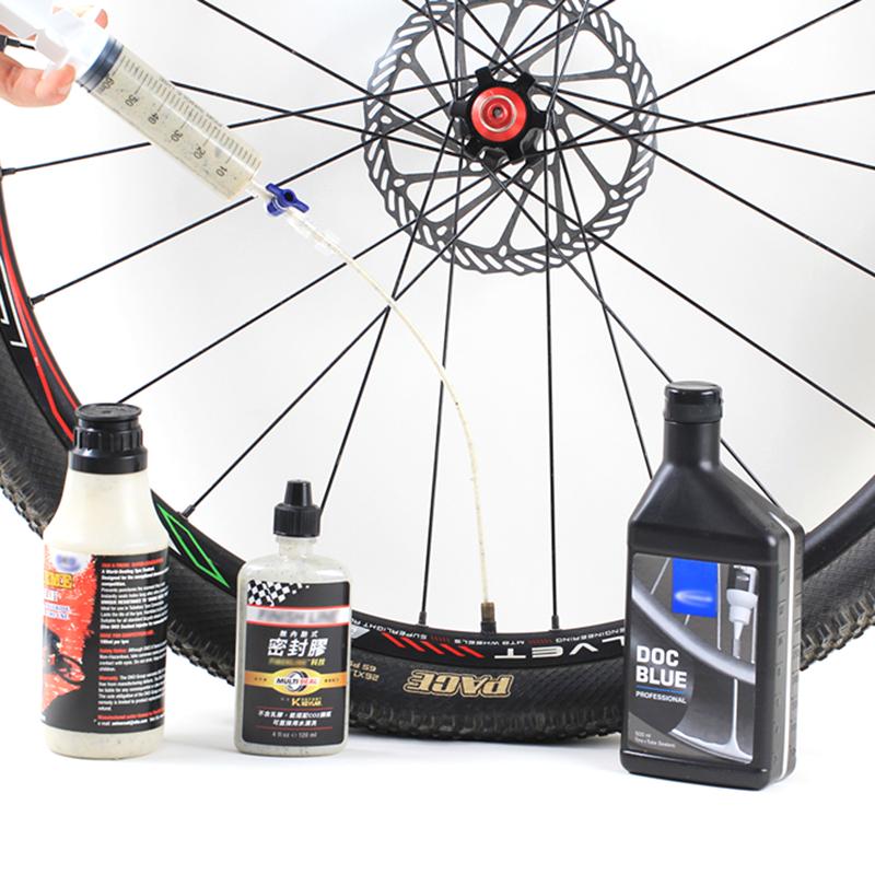 Strumento di iniezione di liquido per pneumatici senza camera d'aria per bicicletta Iniettore di sigillante per pneumatici senza camera d'aria per bicicletta