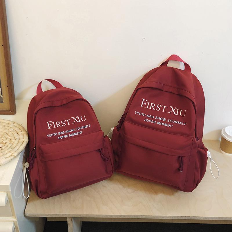 Japanese schoolbag female college student simple fashion letter backpack casual large capacity junior high and high school student computer backpack Small красный