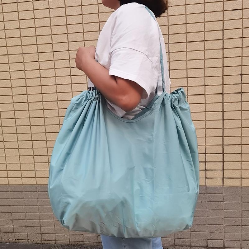 Eco-Friendly Foldable Shopping Tote with Buckle, Drawstring Closure, and Single Shoulder Strap