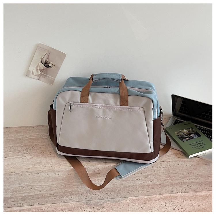 Large Capacity Casual Travel Bag: New Style Lightweight Handheld & Shoulder Luggage Storage for Couples