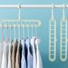 1pc - Nine hole multifunctional magic folding clothes hanger, convenient storage and space saving storage cabinet