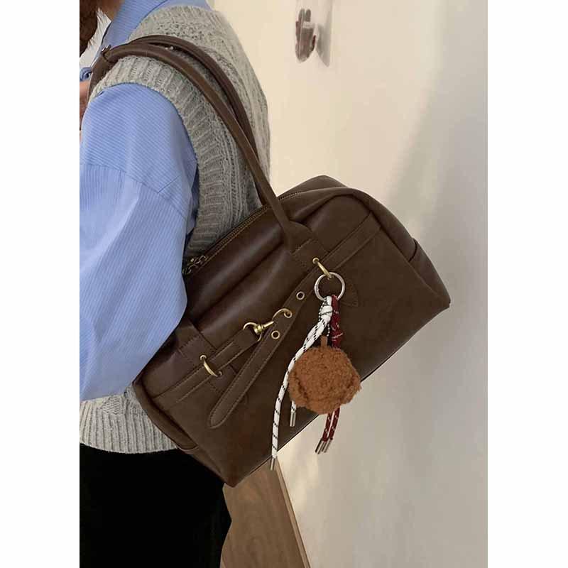 

Retro high-end texture commuter underarm bag women s bag 2025 autumn new bowling bag simple shoulder bag коричневый