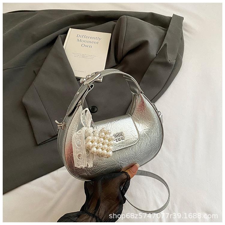 Super fire small bag women 2025 new hand carry crescent bag commuter messenger bag one shoulder armpit dumpling bag