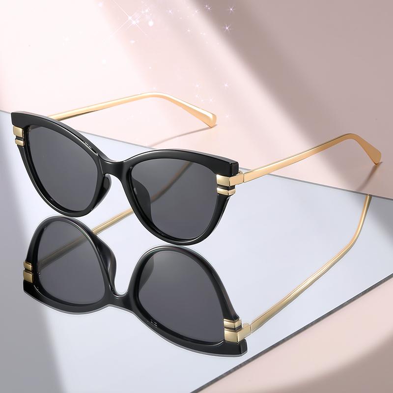 Fashion Cat Eye Sunglasses with Black Top Frame, Red Patterned Lower Frame, Gold Metal Arms, and Gradient Brown Lenses For