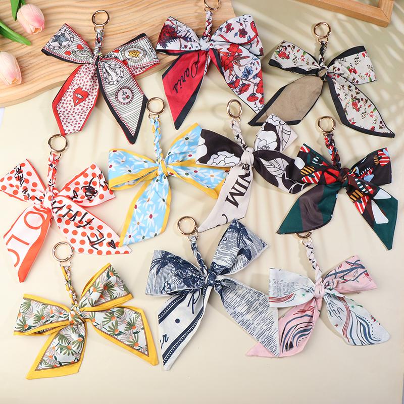 Porte-clés nœud papillon ruban élégant coréen écharpe en soie douce porte-clés porte-clés de voiture breloques de sac pour femmes accessoires de clés pour cadeaux de fille