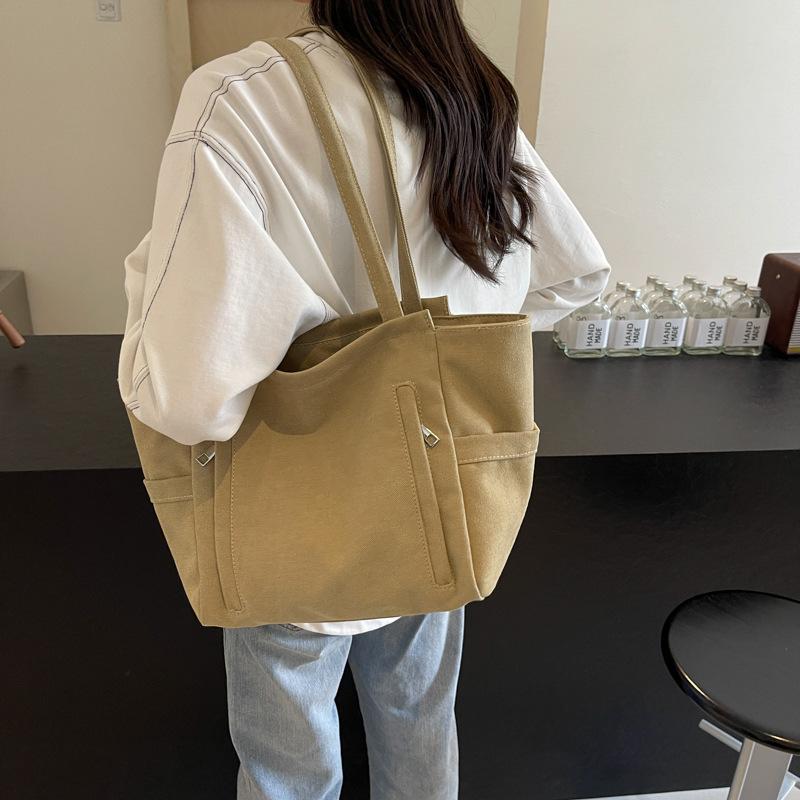 New large-capacity versatile handbag 2025 spring and summer popular lightweight shoulder bag simple tote hand carry big bag women