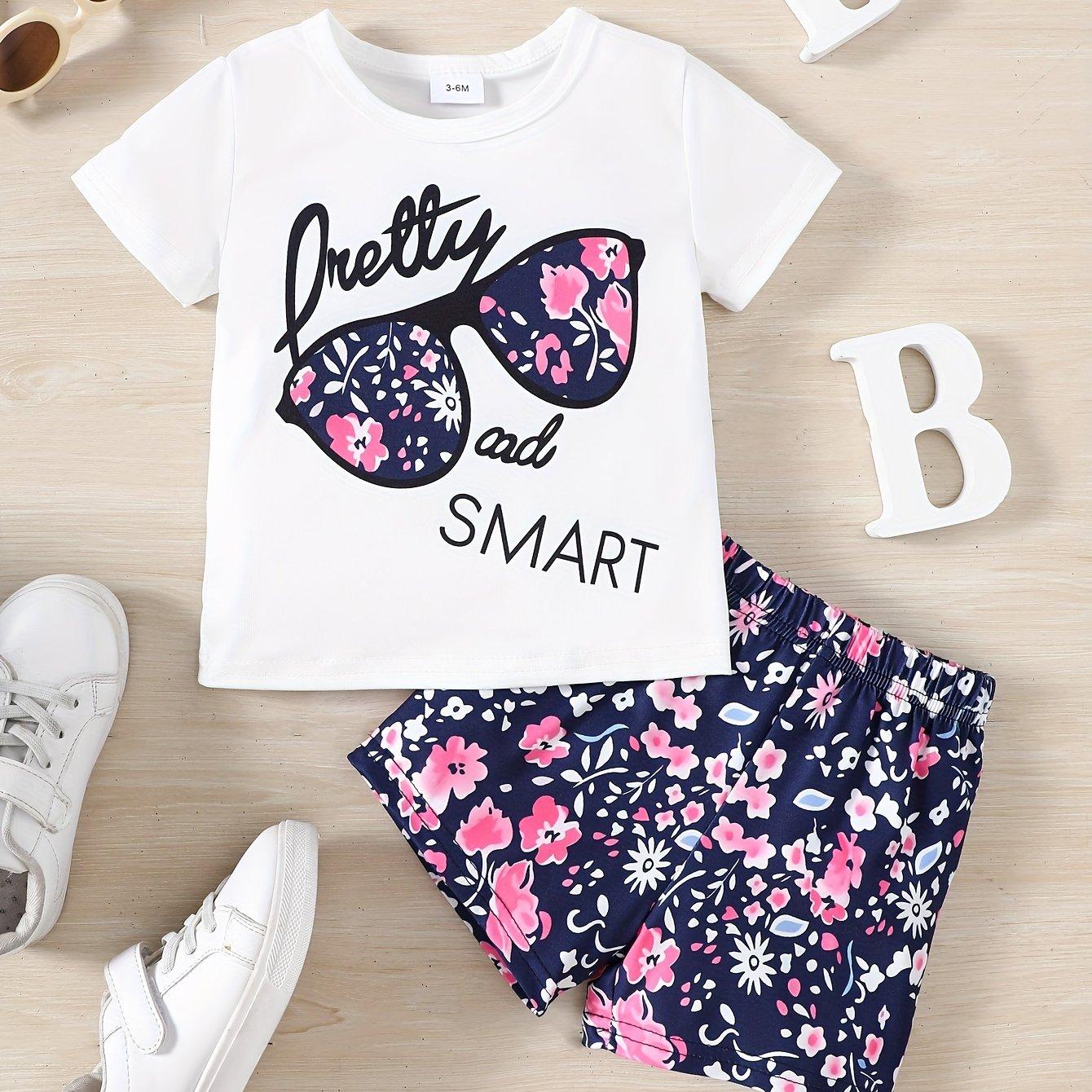 

Комплект из двух предметов: футболка с узором «Pretty & Smart» для девочки и шорты с цветочным принтом 160