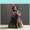 Figura de bruja de Halloween con vestido de tela para decorar una habitación embrujada.